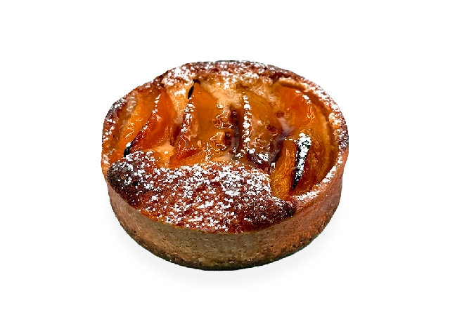Scrumptious French tart with a buttery crust, filled with juicy peach slices, and garnished with a sprinkle of powdered sugar. Pierre and Michel your authentic French bakery