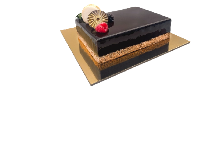 A slice of French Metisse cake, beautifully layered with chocolate sponge, caramel, and creamy filling.