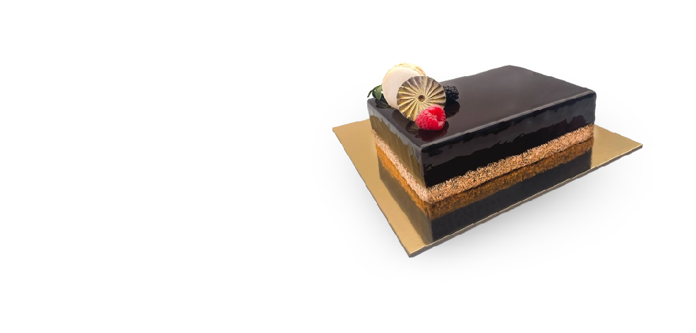 A slice of French Metisse cake, beautifully layered with chocolate sponge, caramel, and creamy filling.