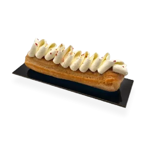 Decadent vanilla eclair with a light pastry shell, filled with creamy vanilla custard, and topped with a glossy layer of icing. Pierre and Michel your authentic French bakery