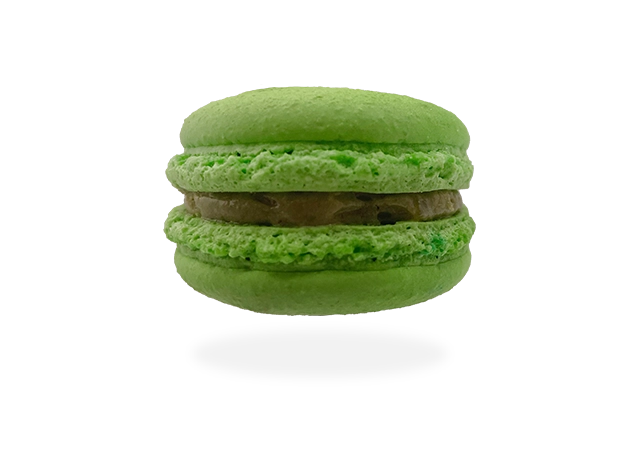 French pistachio macaron with a creamy pistachio filling, delicately garnished with crushed pistachio nuts by Pierre and Michel your authentic French bakery.