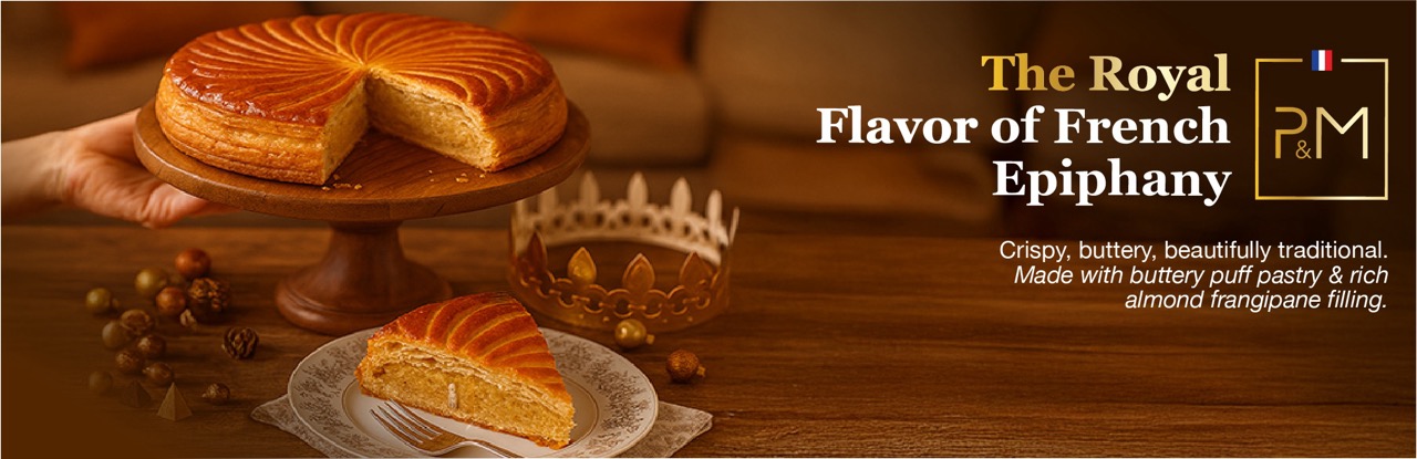Freshly baked French Galette des Rois king cake made in New Jersey bakeries with golden flaky puff pastry and almond frangipane filling, served for Epiphany.